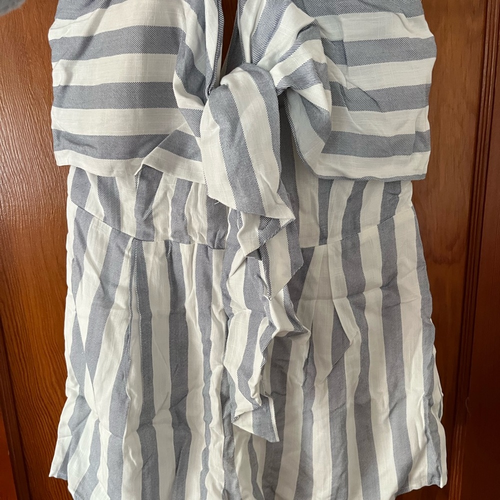 Blue Blush, blue & white stripe romper with a front bow, back zipper.